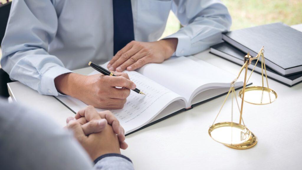 lawyer providing legal information to a client at law office