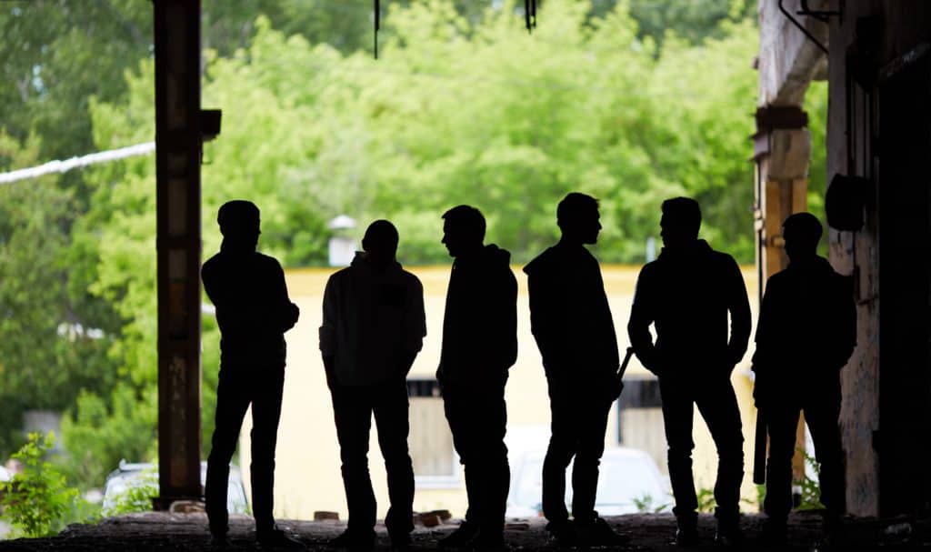 group of gangster youth standing outdoors