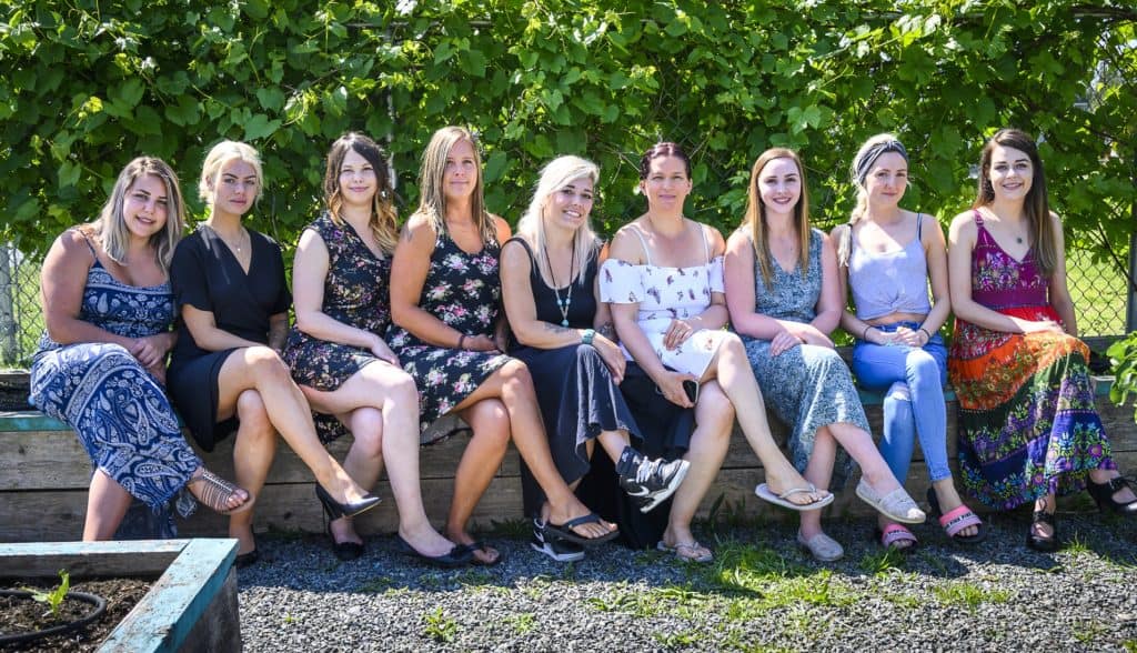 young parents in new beginnings program sit outside together