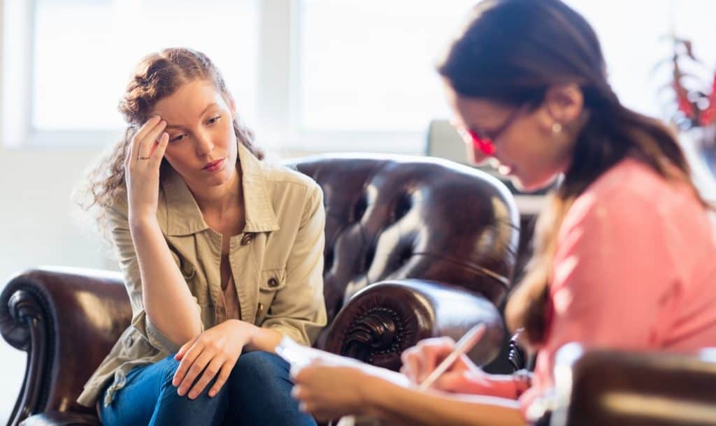 Psychologist having therapy session with her patient