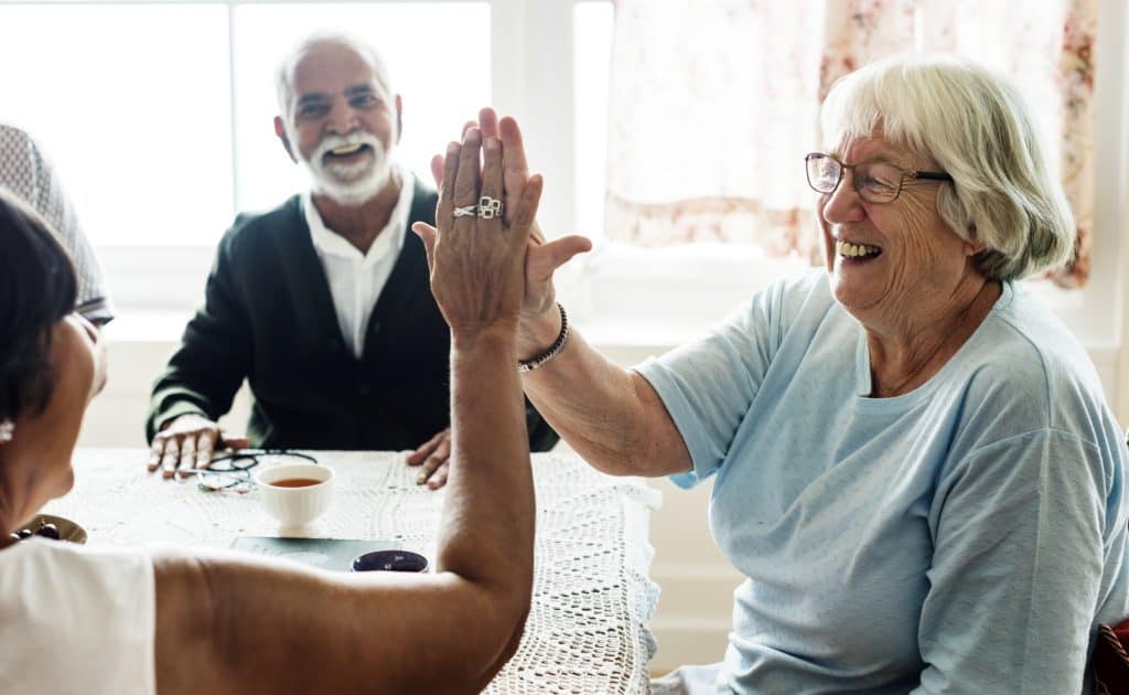 Seniors enjoying coffee and tea with friends