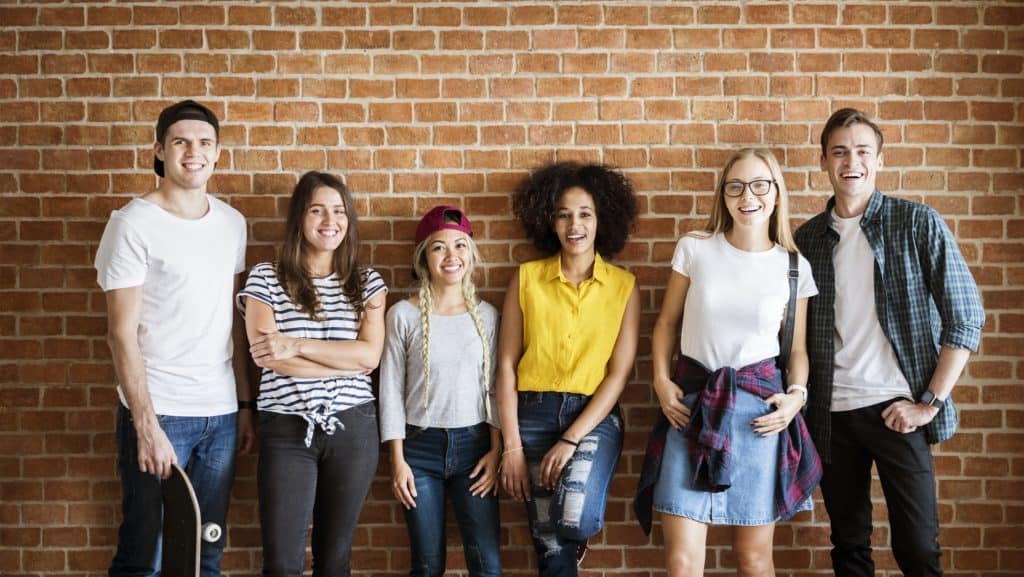 happy group of youth friends standing together