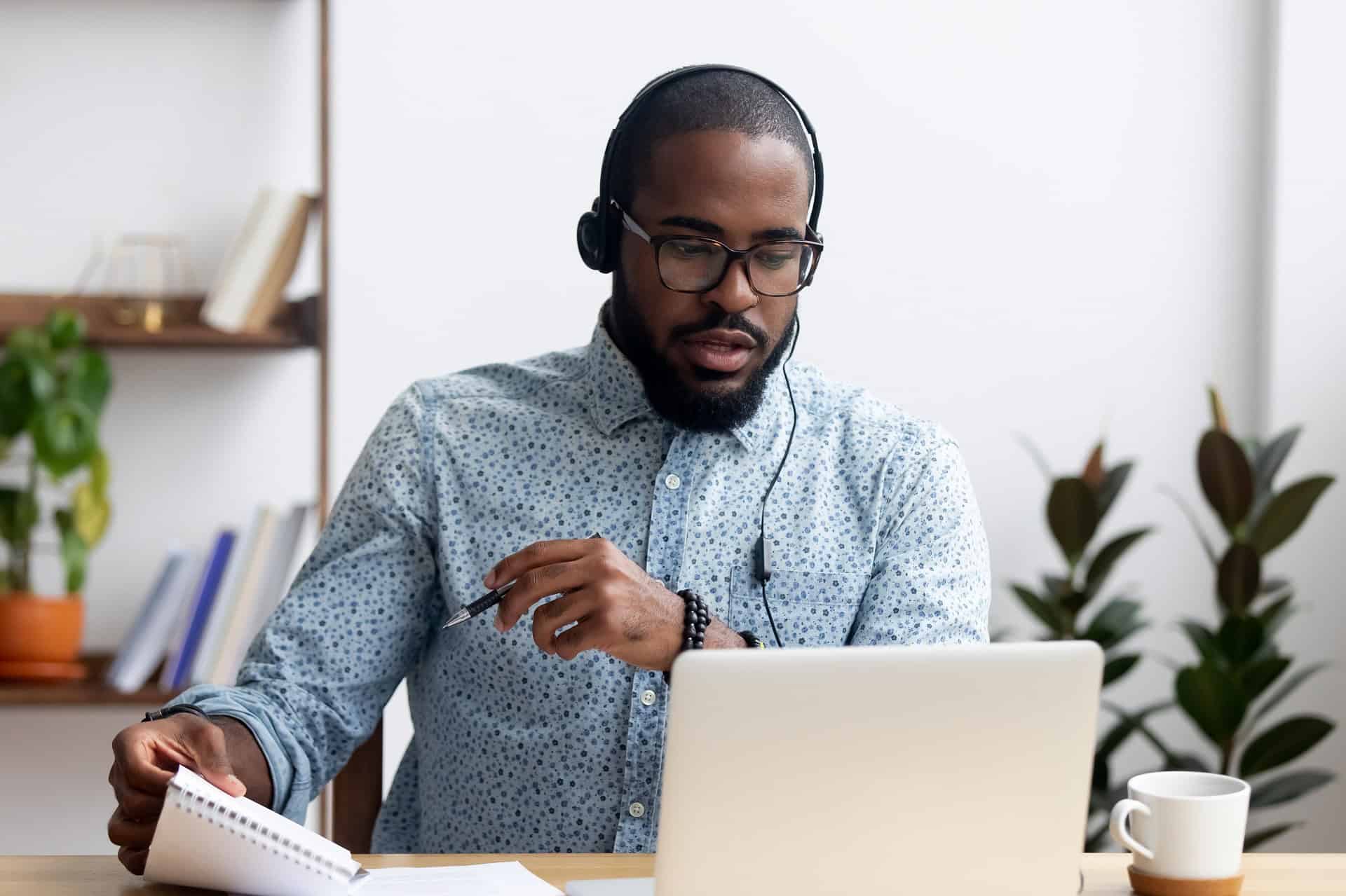 professional man learning a foreign language at his home office