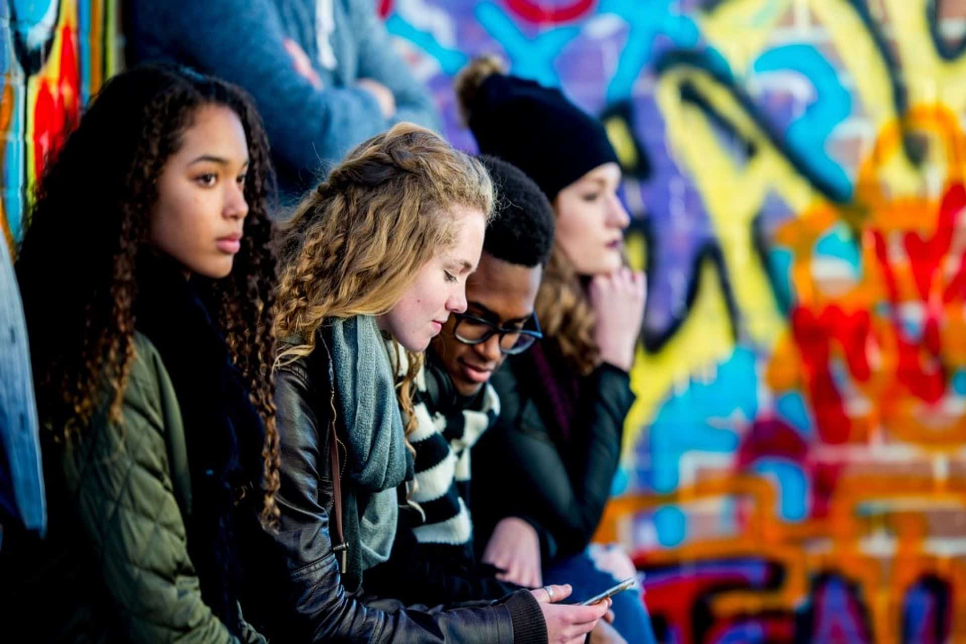 Happy family in the park carrying kids on their back