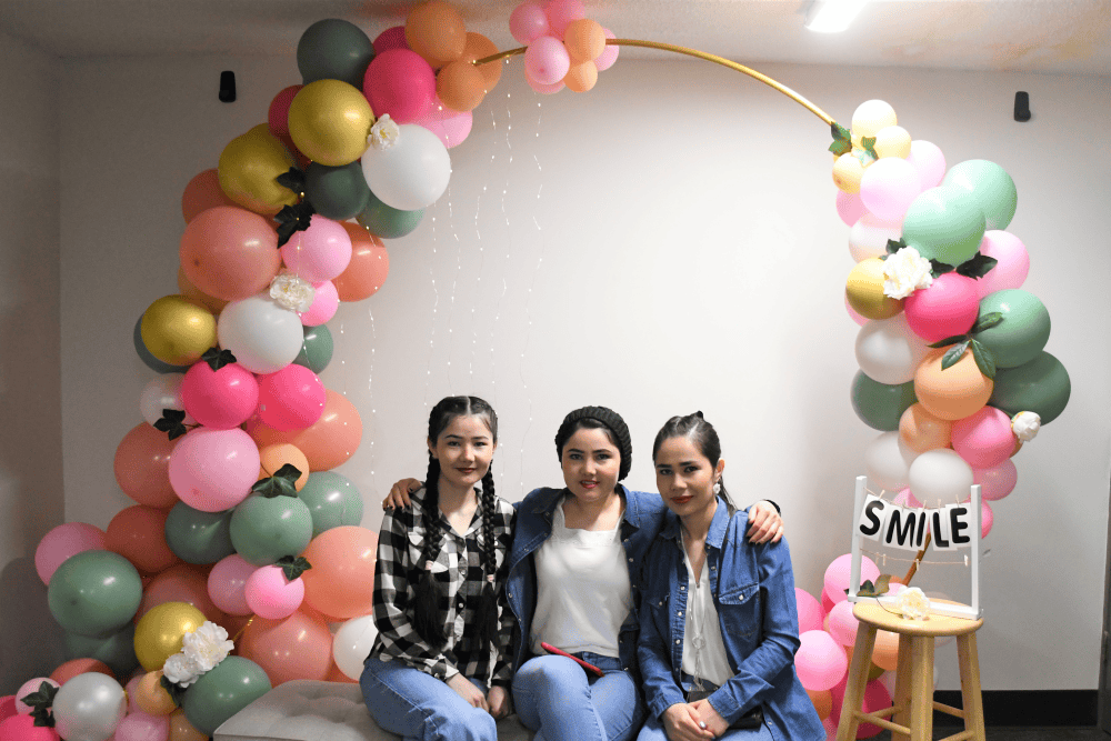 Attendees at photobooth at ladies night