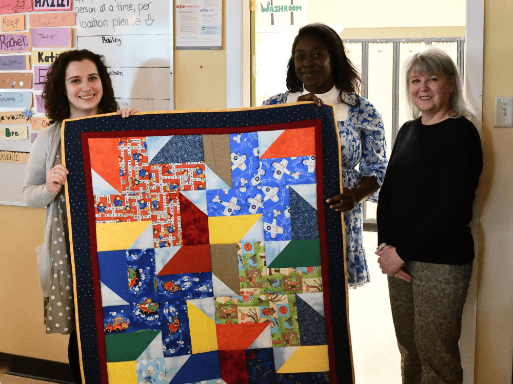 Graduate of the New Beginnings Young Parent Program accepts scholarship