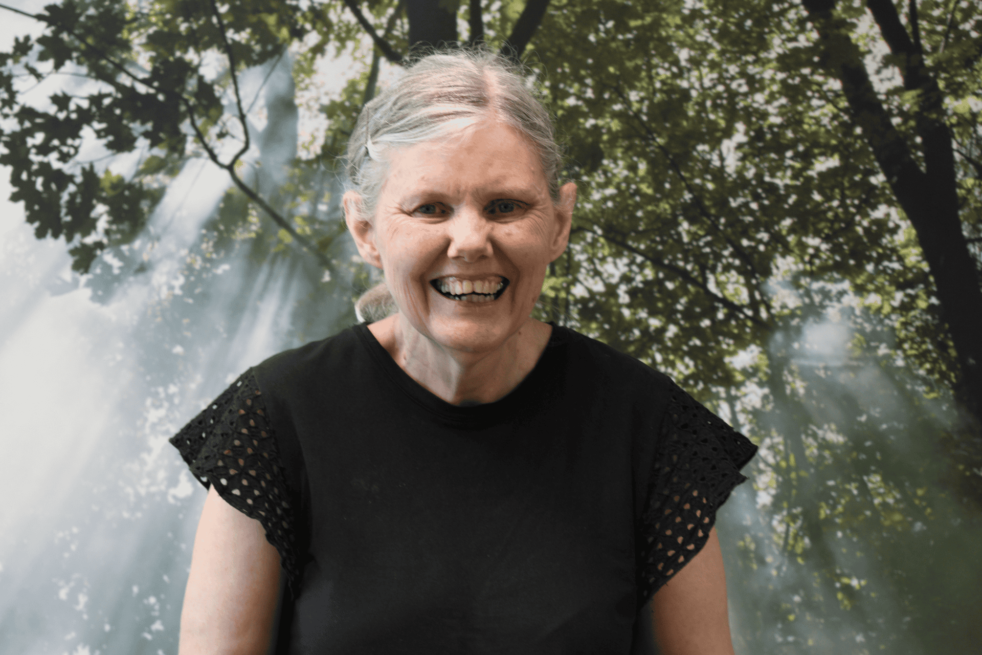 two young girls wearing hijabs pose with arms around each other