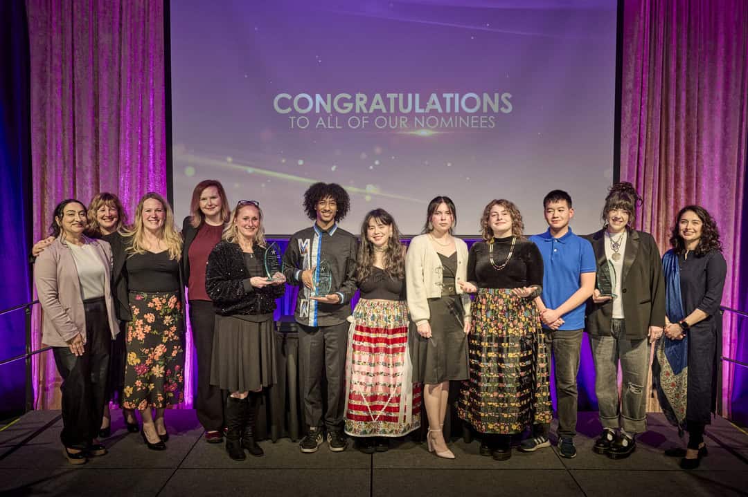 Group of people holding awards posing for a picture