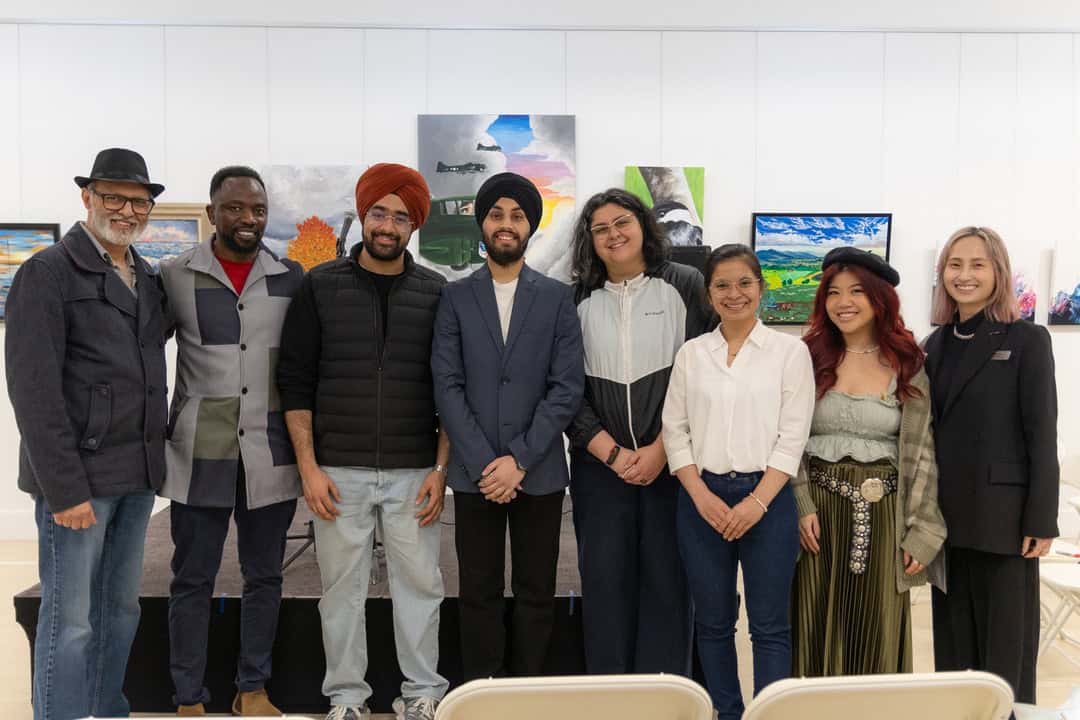 Diverse group of people posing for a picture 