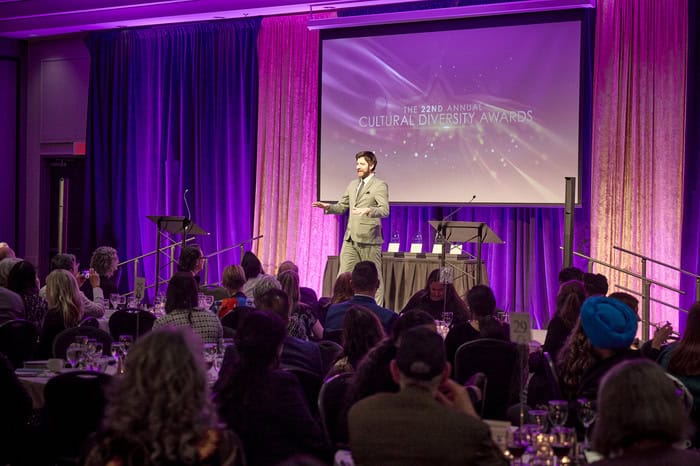 Man speaking on a stage