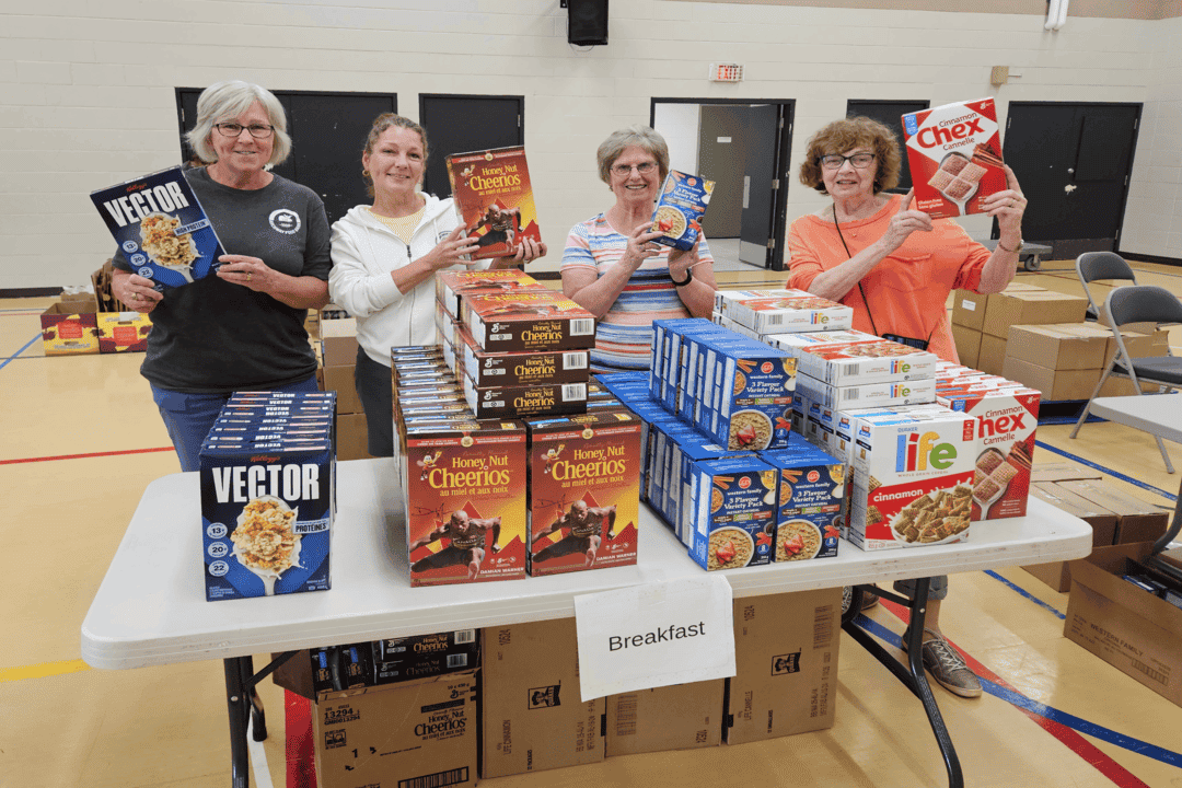 Summer Starfish volunteers Four volunteers holding food donations