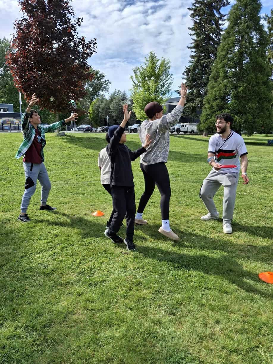 Kids playing frisbee in the park
