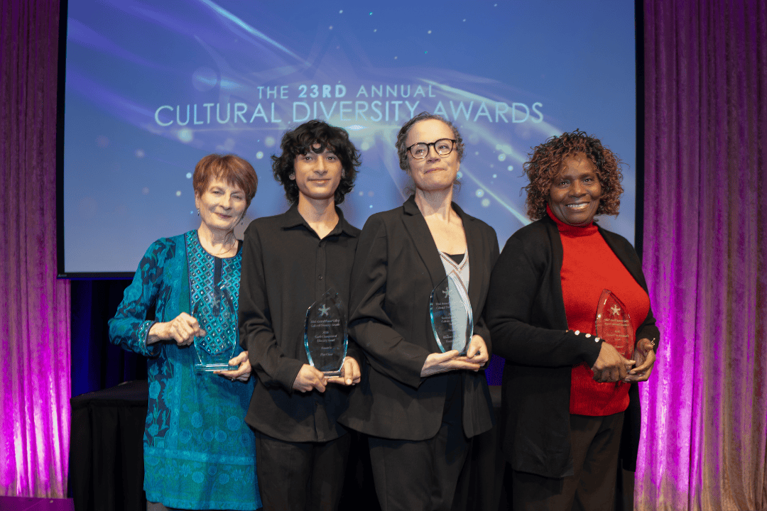 4 individuals holding awards