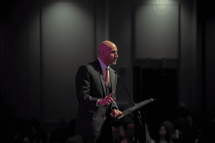 Man speaking on a stage