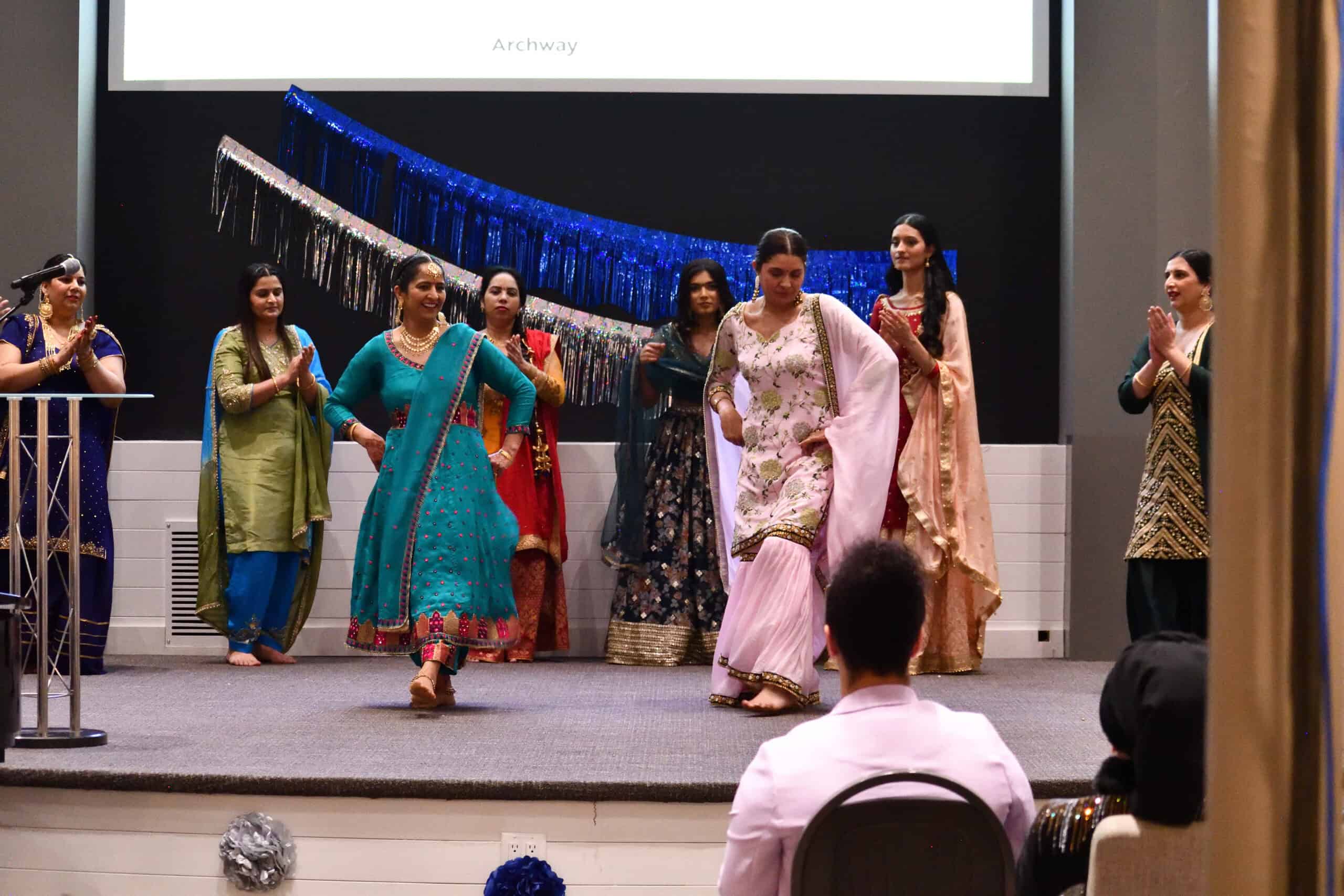 Giddha dancers perfoming on stage at the 13th annual International Women’s Day event 