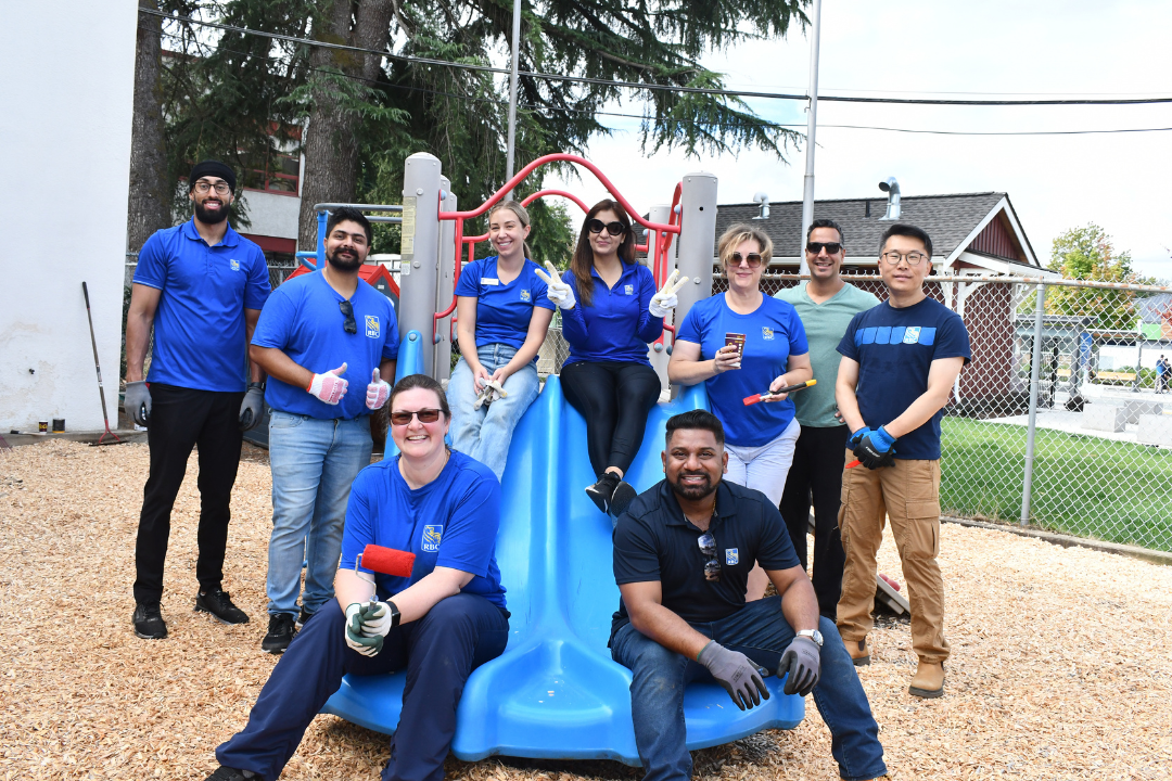 Group of people posing for a picture in a playground