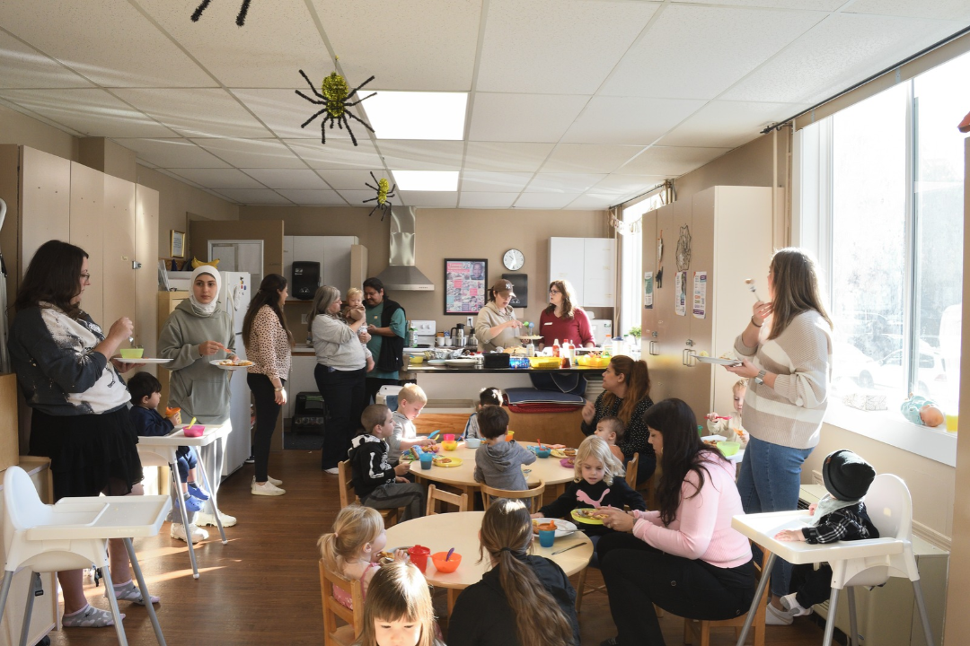 Parents and children eating breakfast